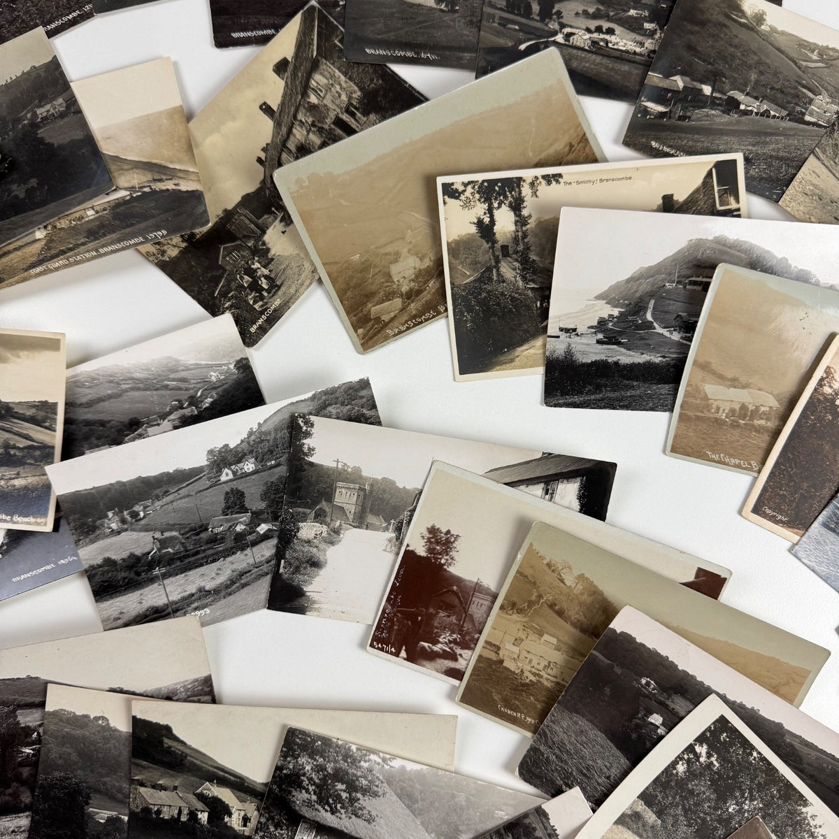 Collection of 54 black and white RP postcards of Branscombe Devon one lot